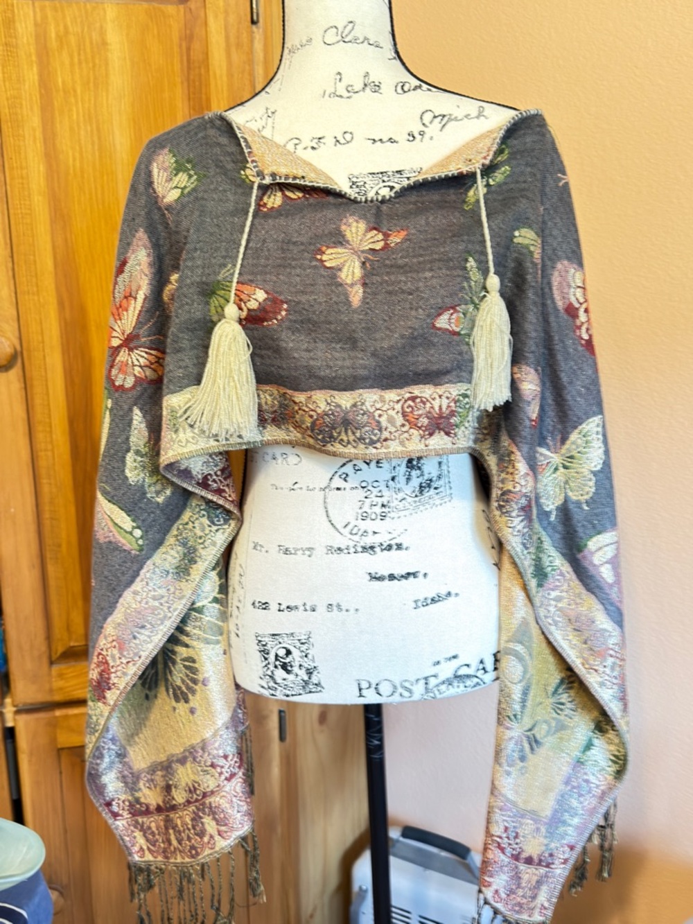 Butterfly Tassel Pashmina Wrap over shoulders. Beautiful gold metallic look.